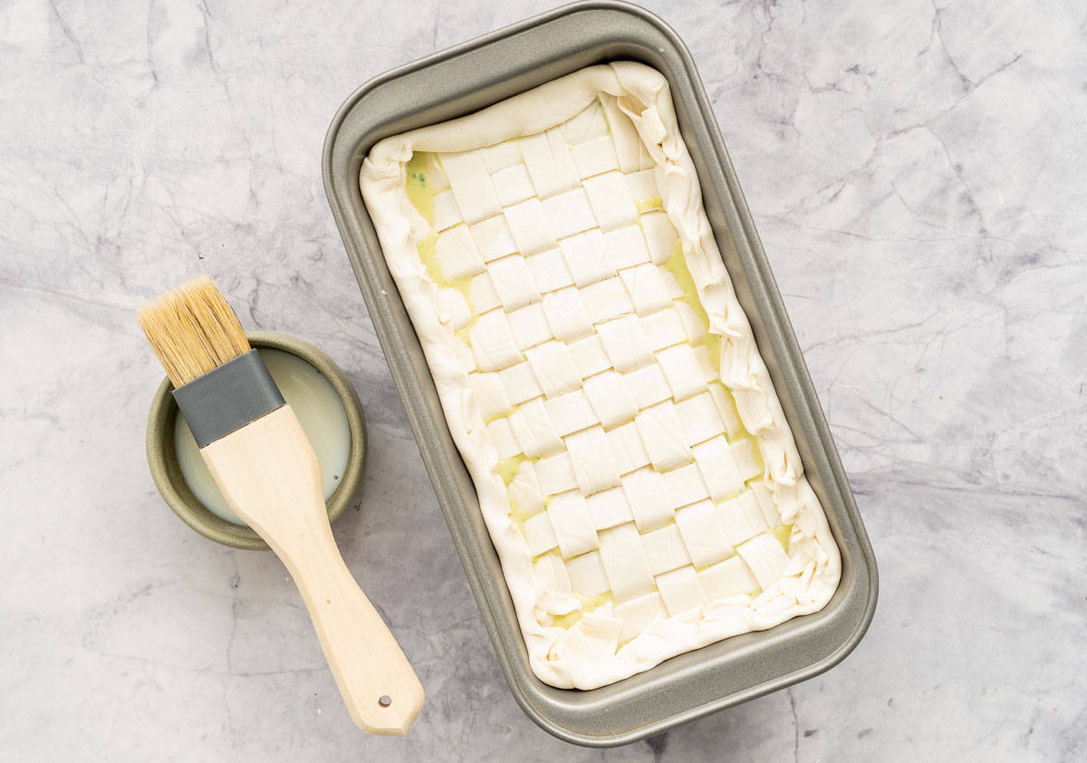 A lattice topped pie ready to go into the oven.