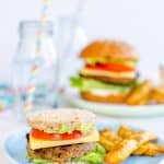 Small kid sized burger on a blue plate