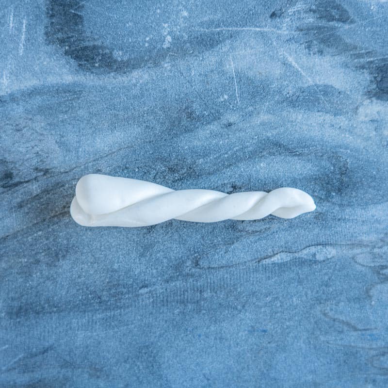 Two pieces of fondant twisted together.