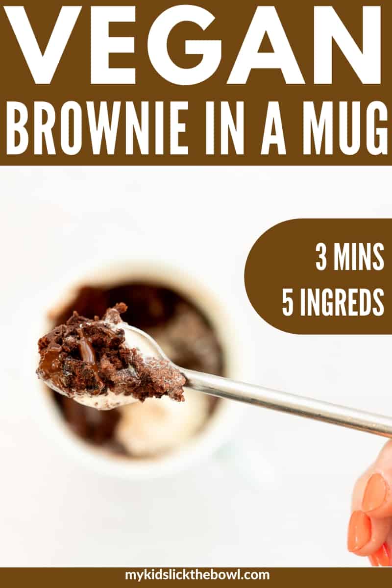 Vegan brownie in a mug title, hand holding spoon scooping brownie out of mug.