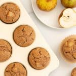 top down view of pear muffins in a cream muffin tin