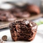 Chocolate muffin with bite taken out of it.