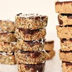 Two tall stacks of square bars.