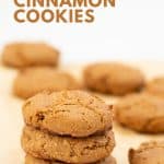 A stack of three cinnamon cookies sitting on parchment paper with text overlay.