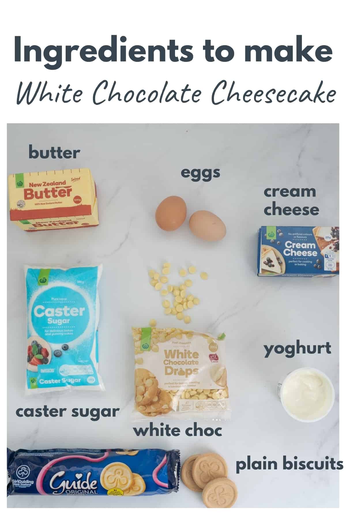 Ingredients to make a white chocolate cheese cake laid out on a bench top with text overlay.