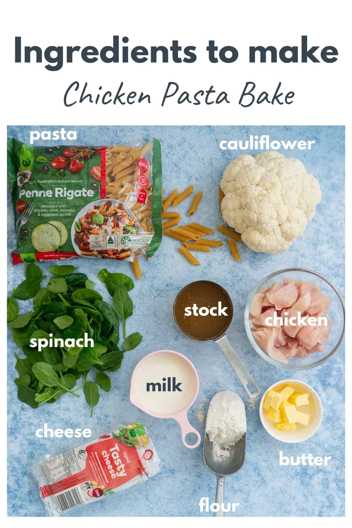 The ingredients to make chicken pasta bake laid out on a blue bench top with text overlay.