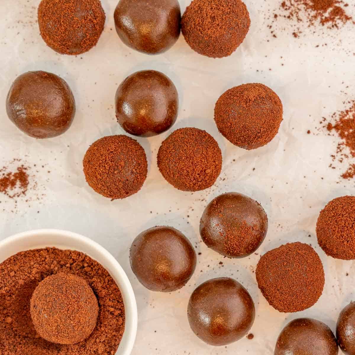 16 Milo dusted milo balls on a white serving platter.