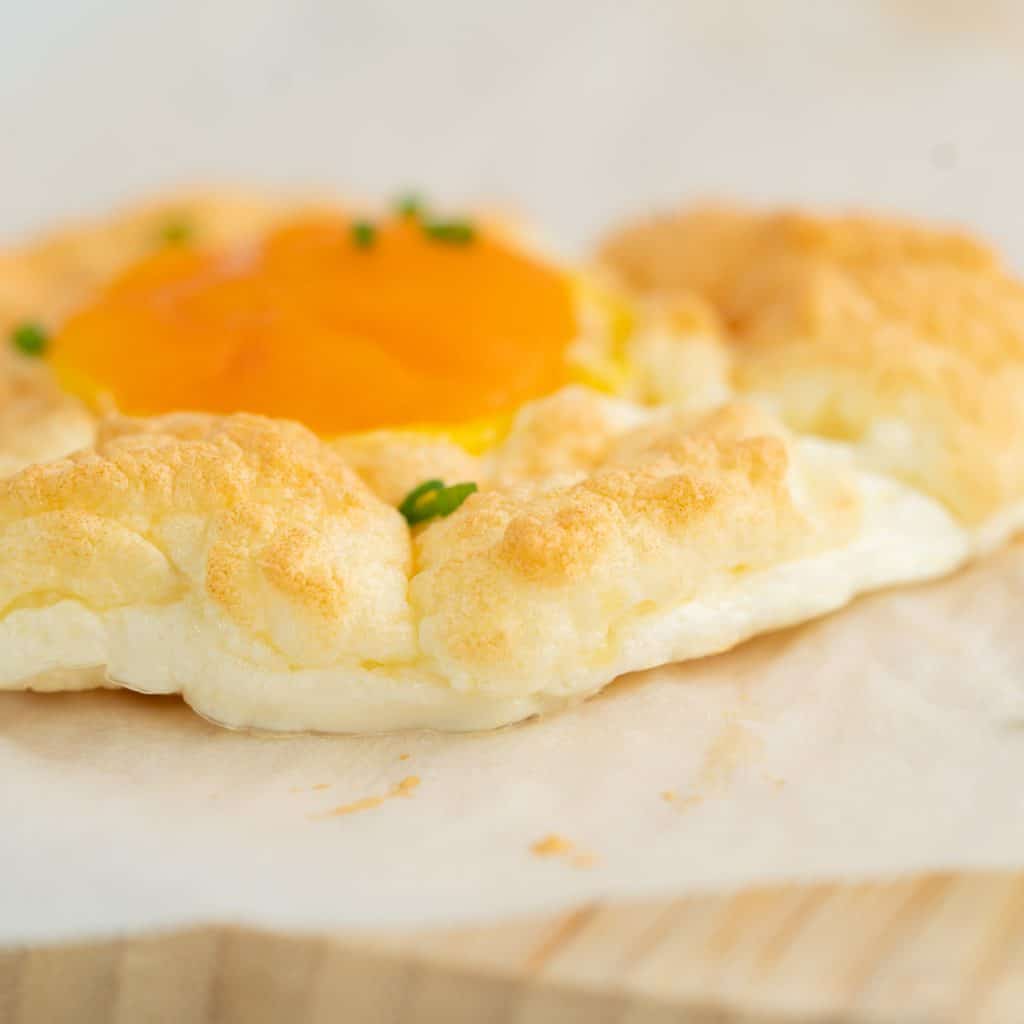 side profile of a cloud egg showing the fluffy baked white.
