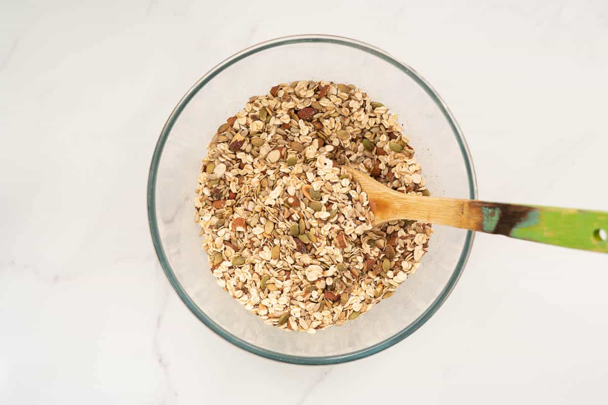 Nuts, seeds and rolled oats in a large mixing bowl.