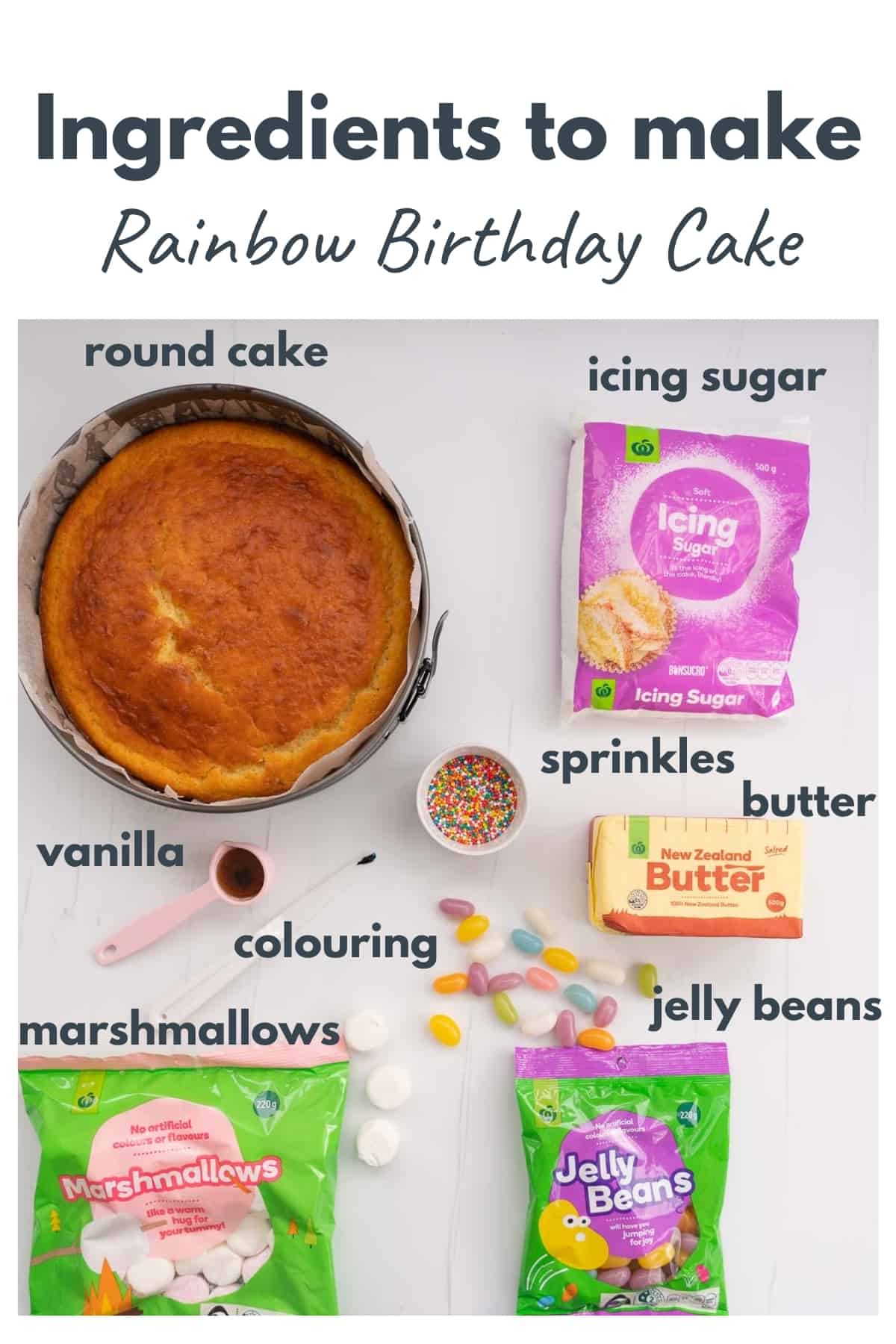 Ingredients to make a rainbow birthday cake laid out on a bench top with text overlay.