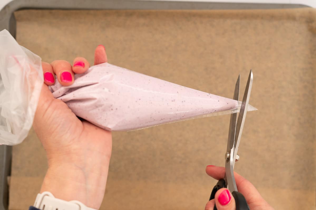 Purple blueberry flavoured yoghurt in a piping bag.
