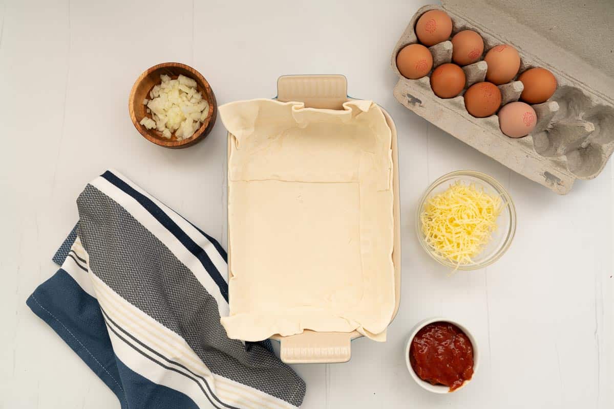 A rectangular pie dish lined with pastry.