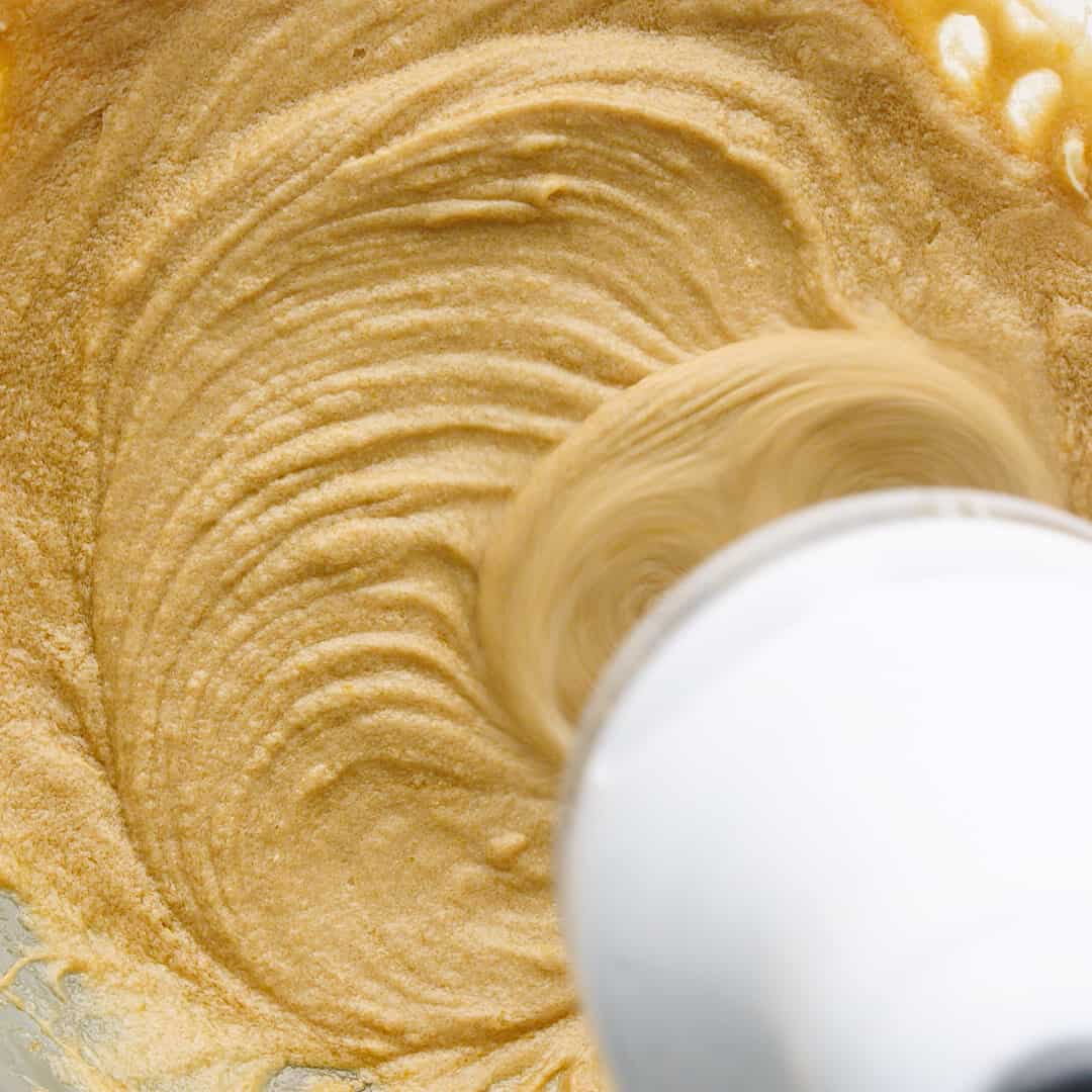 Electric beater creming butter brown sugar and eggs.