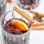 A cut glass tumbler filled with mulled wine.