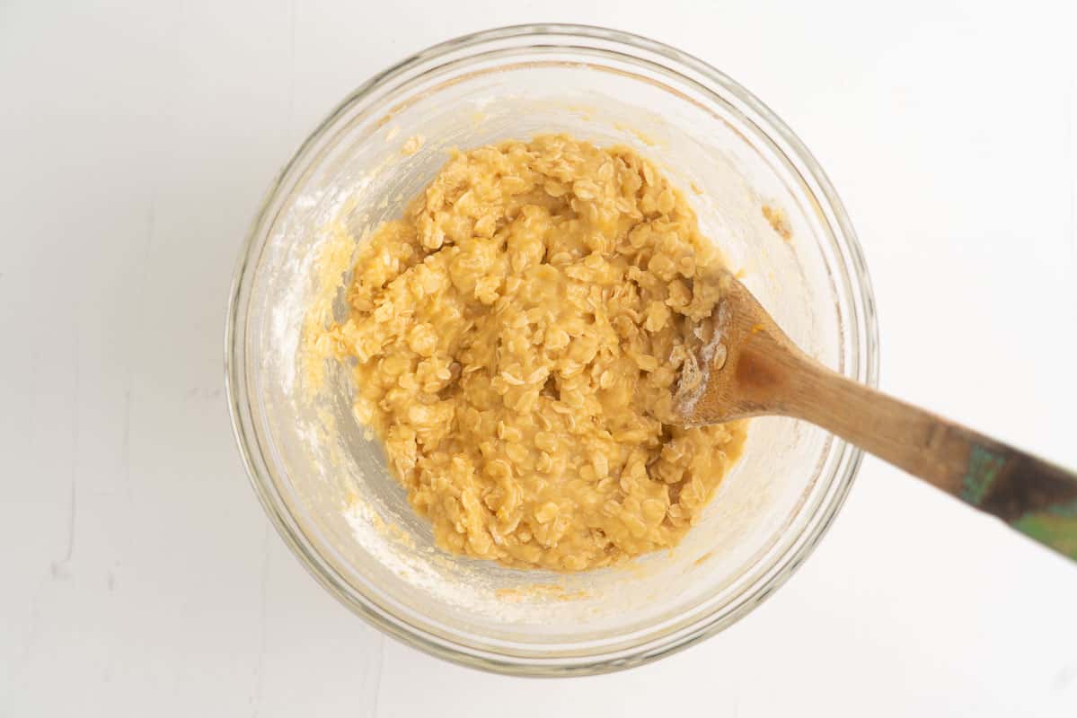Lemon cookie dough in a glass mixing bowl.
