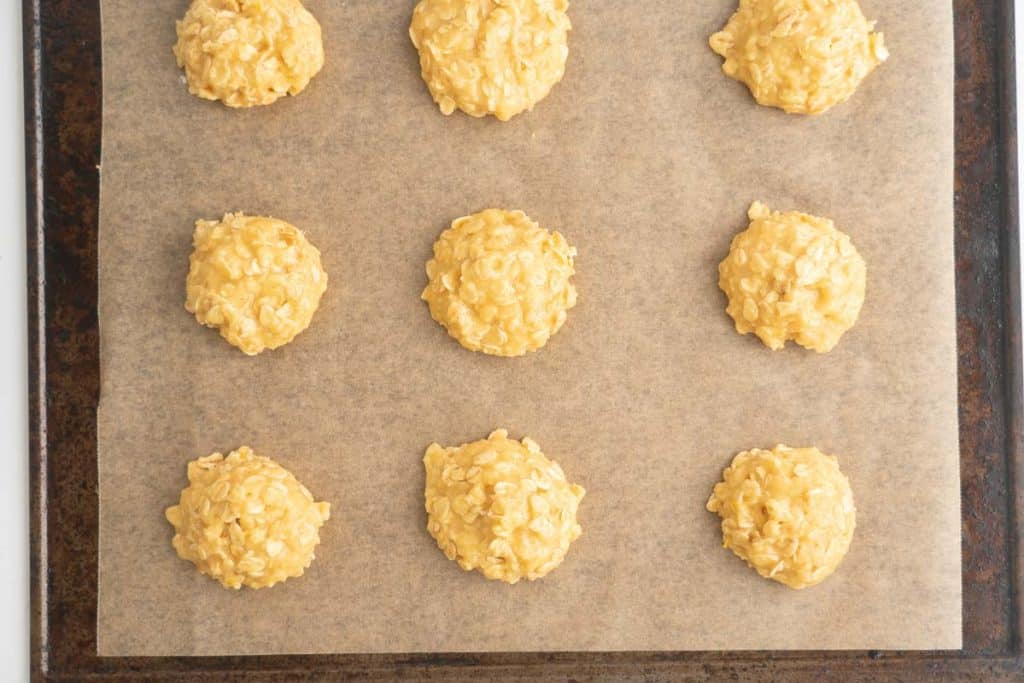 Lemon oatmeal cookie dough balls ready to go into the oven to bake.