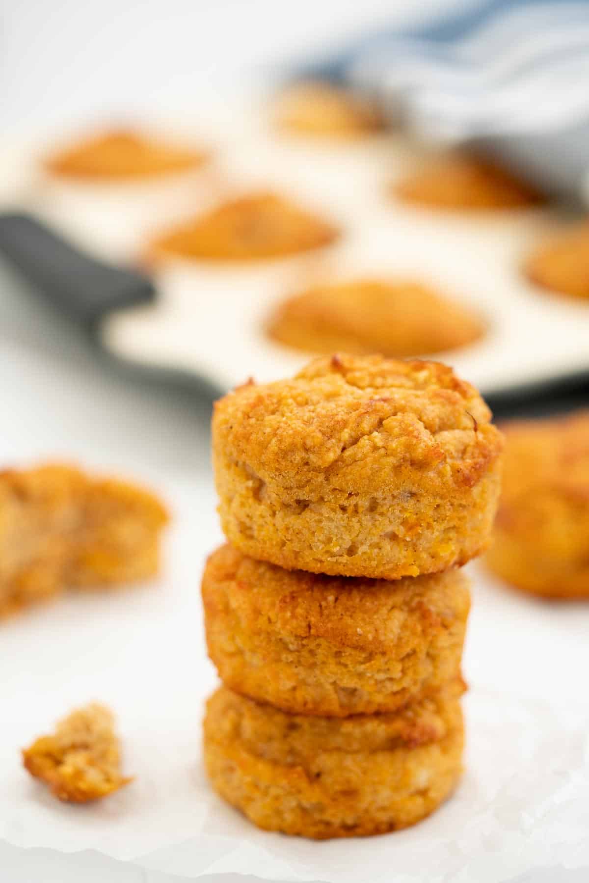 A tower of three sweet potato muffins.