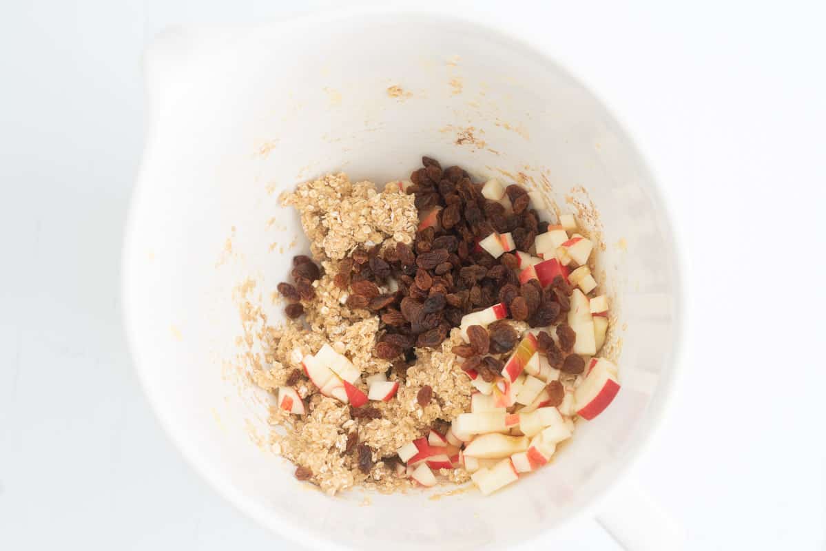 Diced apple and raisins ready to be mixed into oatmeal cookie dough.