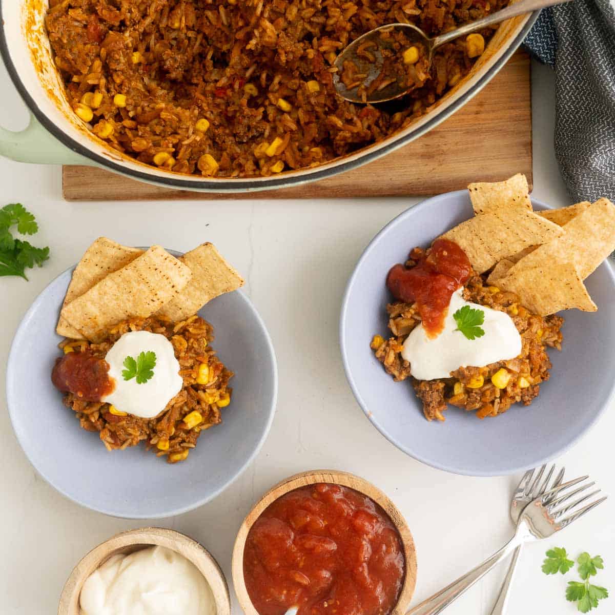 A dinner table with bowls of Mexican mince ready to eat.
