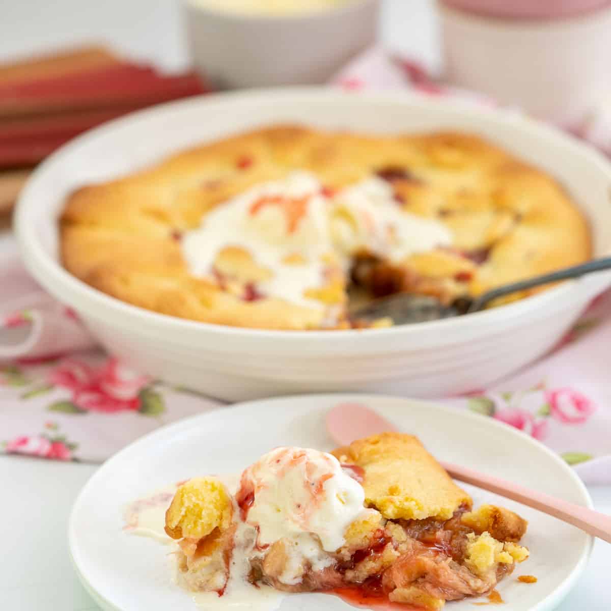 A slice of rhubarb galette topped with vanilla ice cream.
