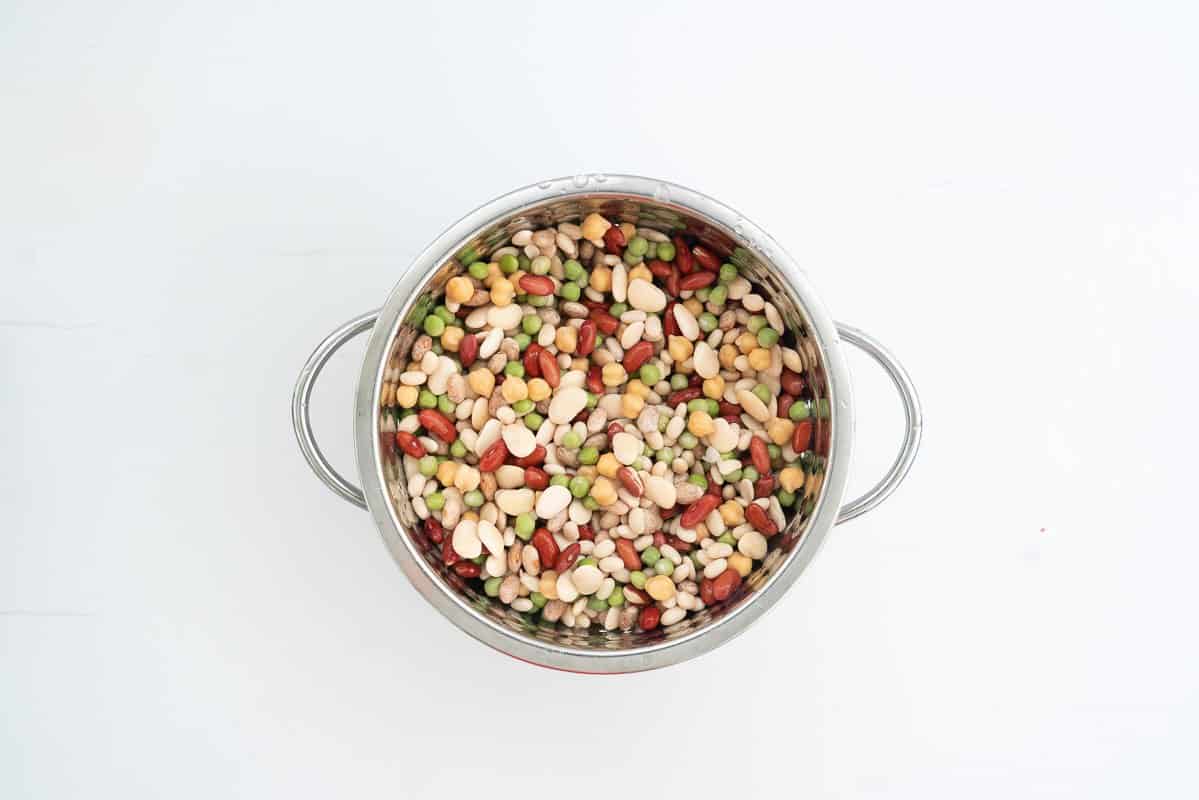 Drained soaked beans in a colander.