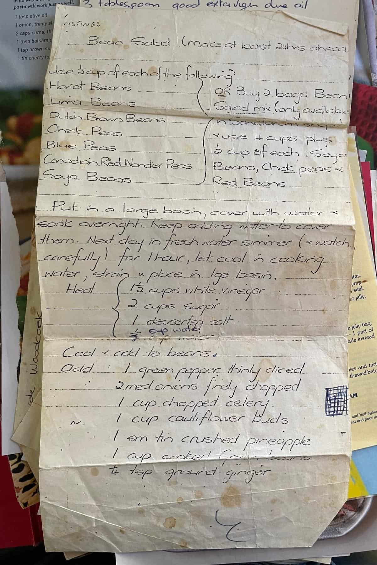 Aged hand-written ingredients and methods to make mixed bean salad.