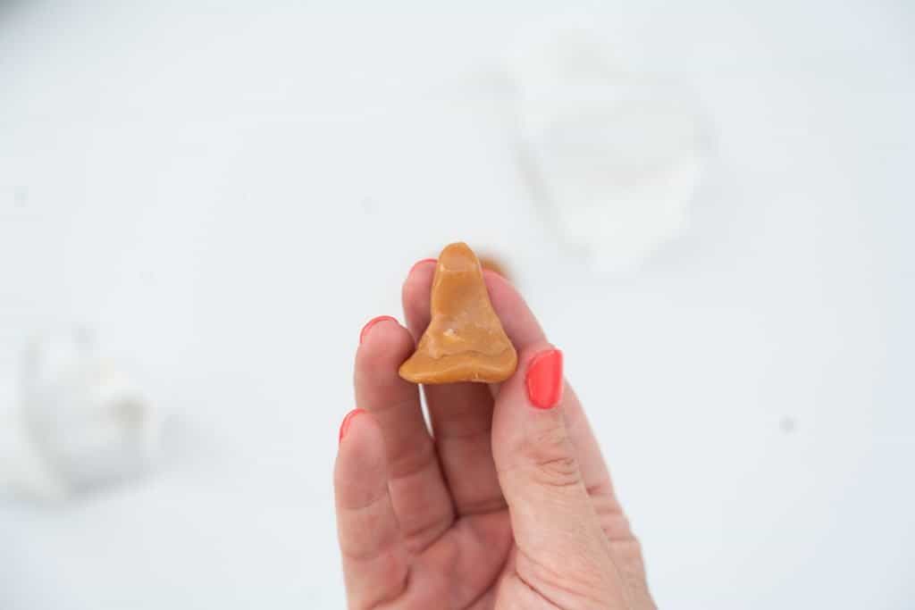 A toffee rolled into a rough cone shape.