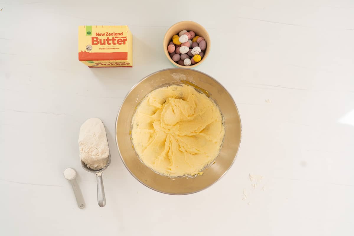 creamed butter and sugar in a stainless steel cake mixing bowl.