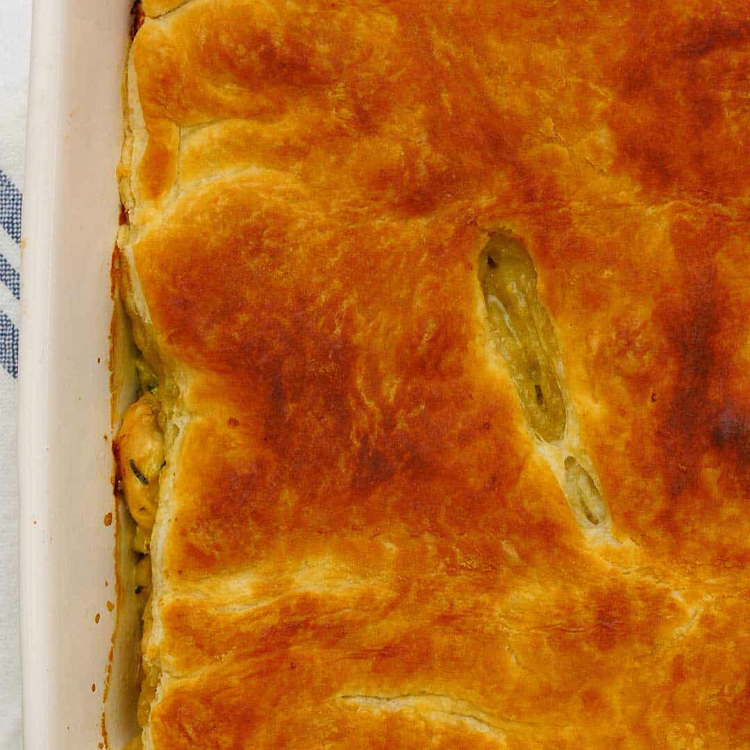 Golden baked pastry on the top of a pie dish.