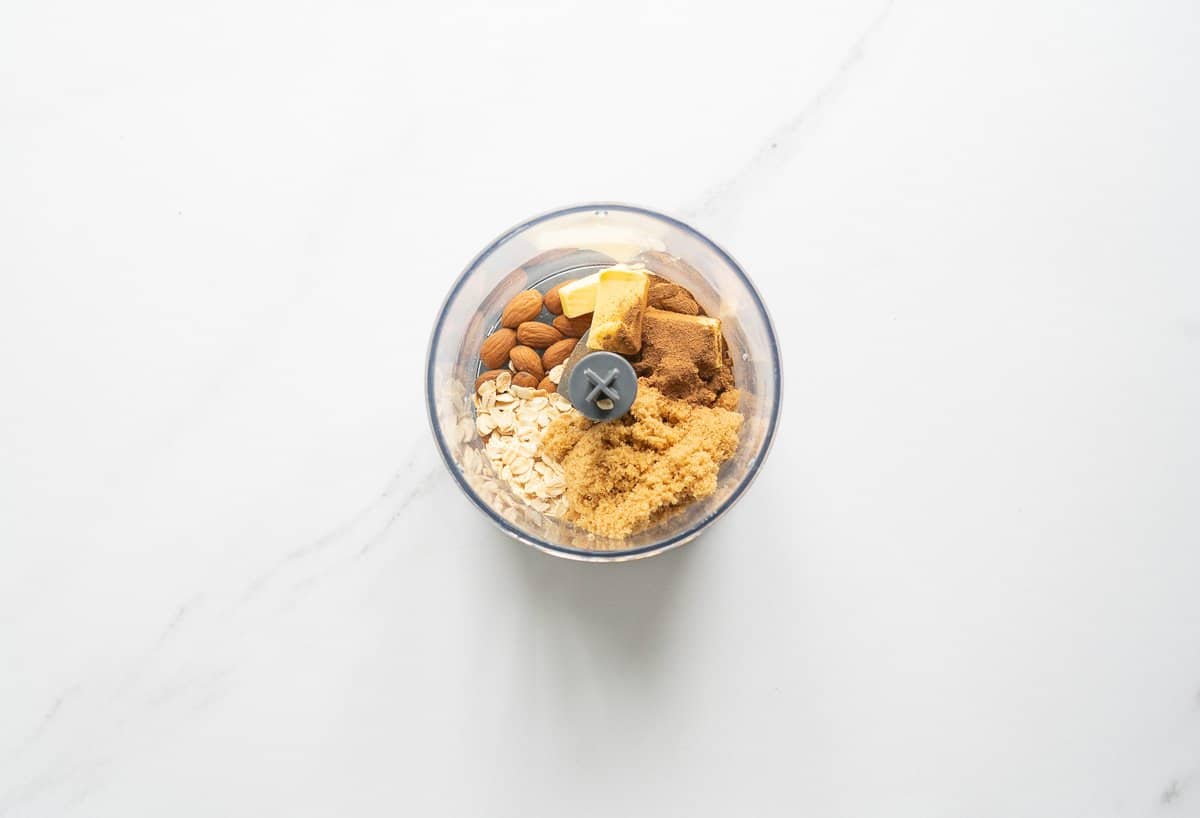 Almonds, oats, cubed butter spices and brown sugar in a small food processor.