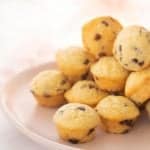 A pink plate piled high with mini muffins with text overlay.