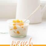 A glass jar of creamy white oats topped with diced peaches, a long parfait spoon and ceramic white jug in the background with text overlay.