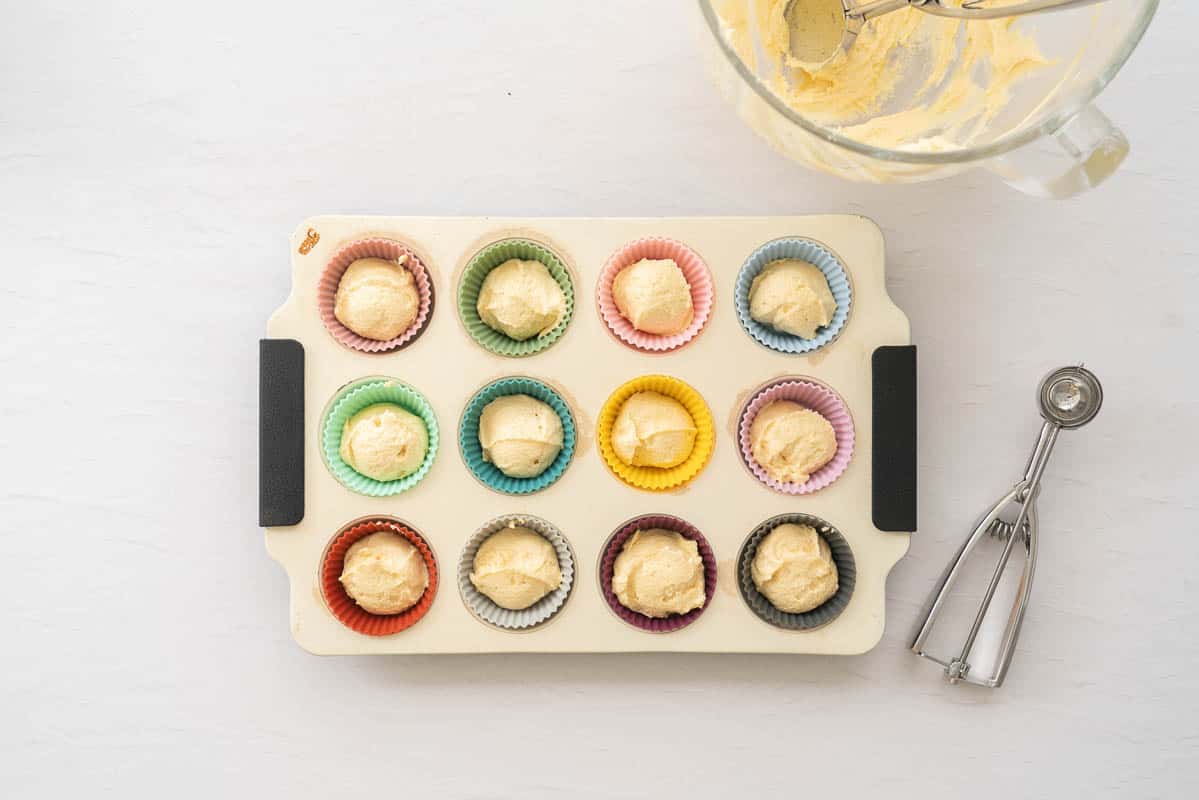Batter portioned into 12 cupcake cases.