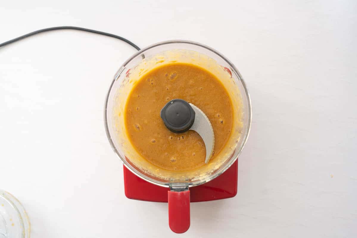 Chickpeas blended with maple syrup into a smooth light brown sauce.