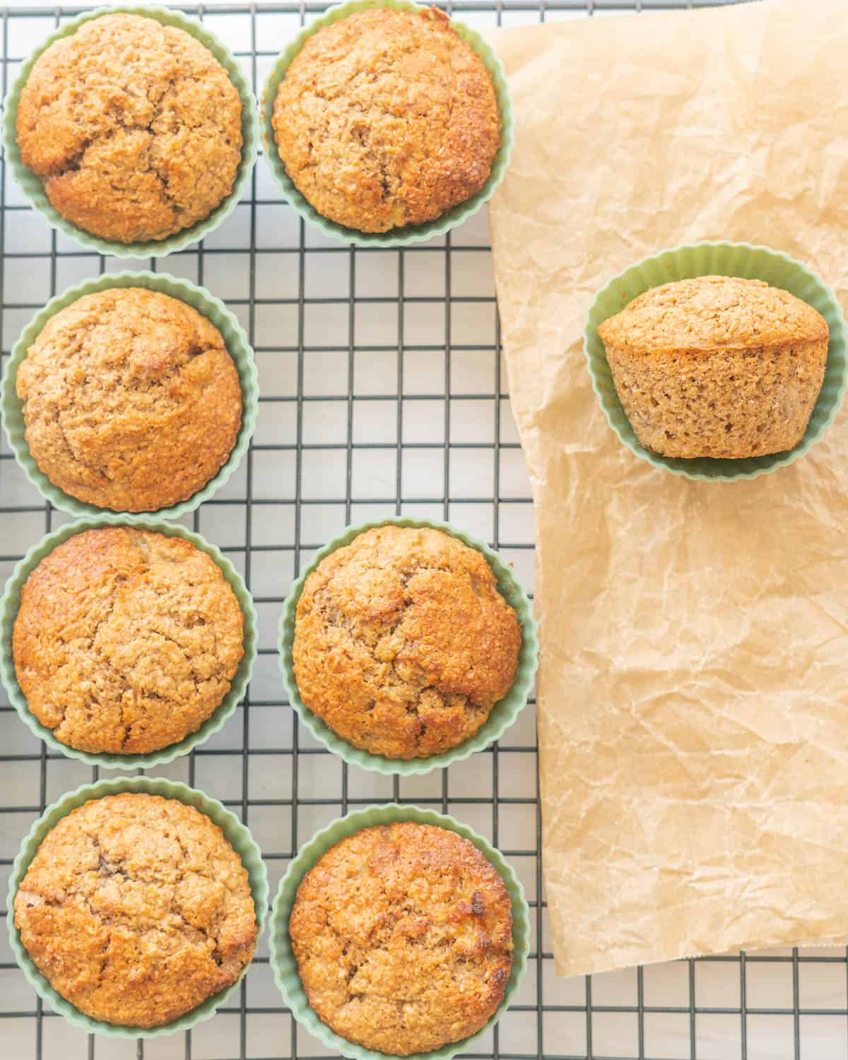 Bran muffins cooling on a rack.