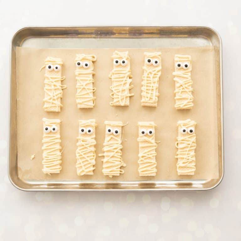 vanilla wafer biscuits decorated to look like mummies.
