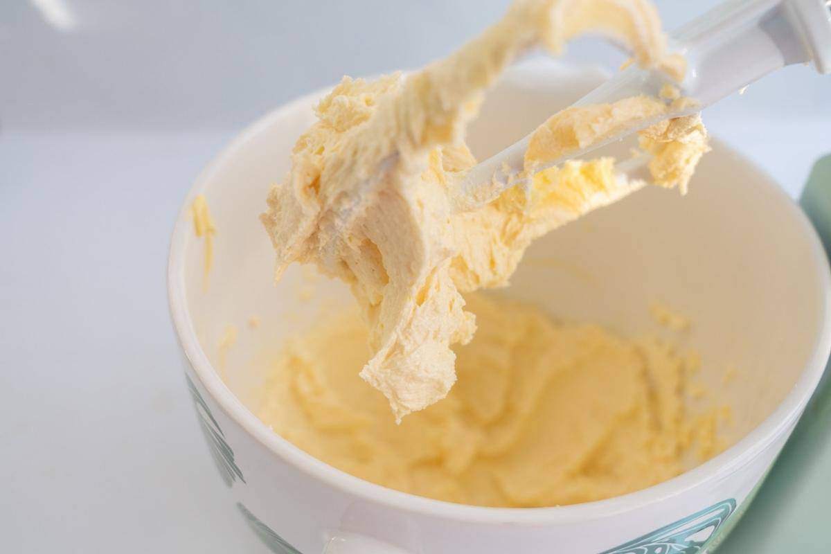 Creamed butter and sugar in the bowl of an electric stand mixer.