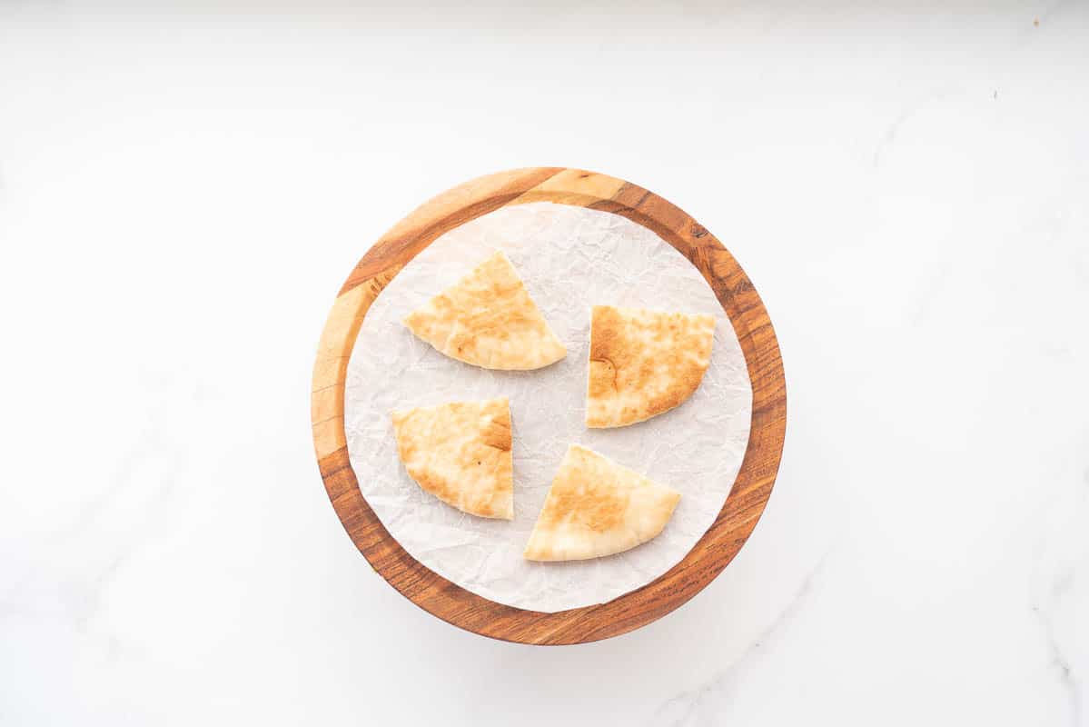 A pita bread cut into quarters.