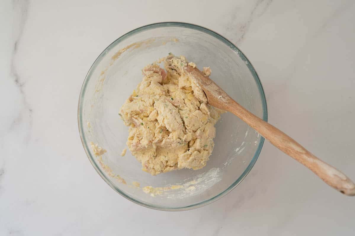A ball of scone dough in a mixing bowl.