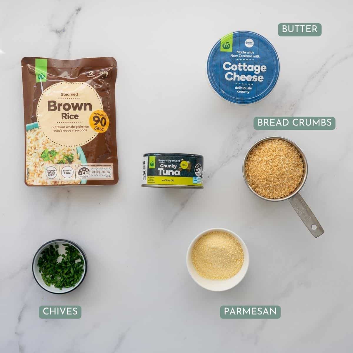 The ingredients to make tuna rice balls laid out on a bench top with text overlay.