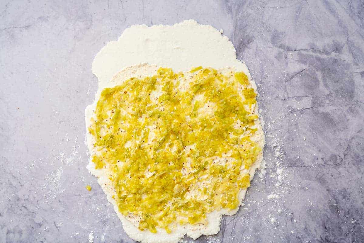 Cooked leeks on top of our cream and mustard spread over a rectangle pizza base.