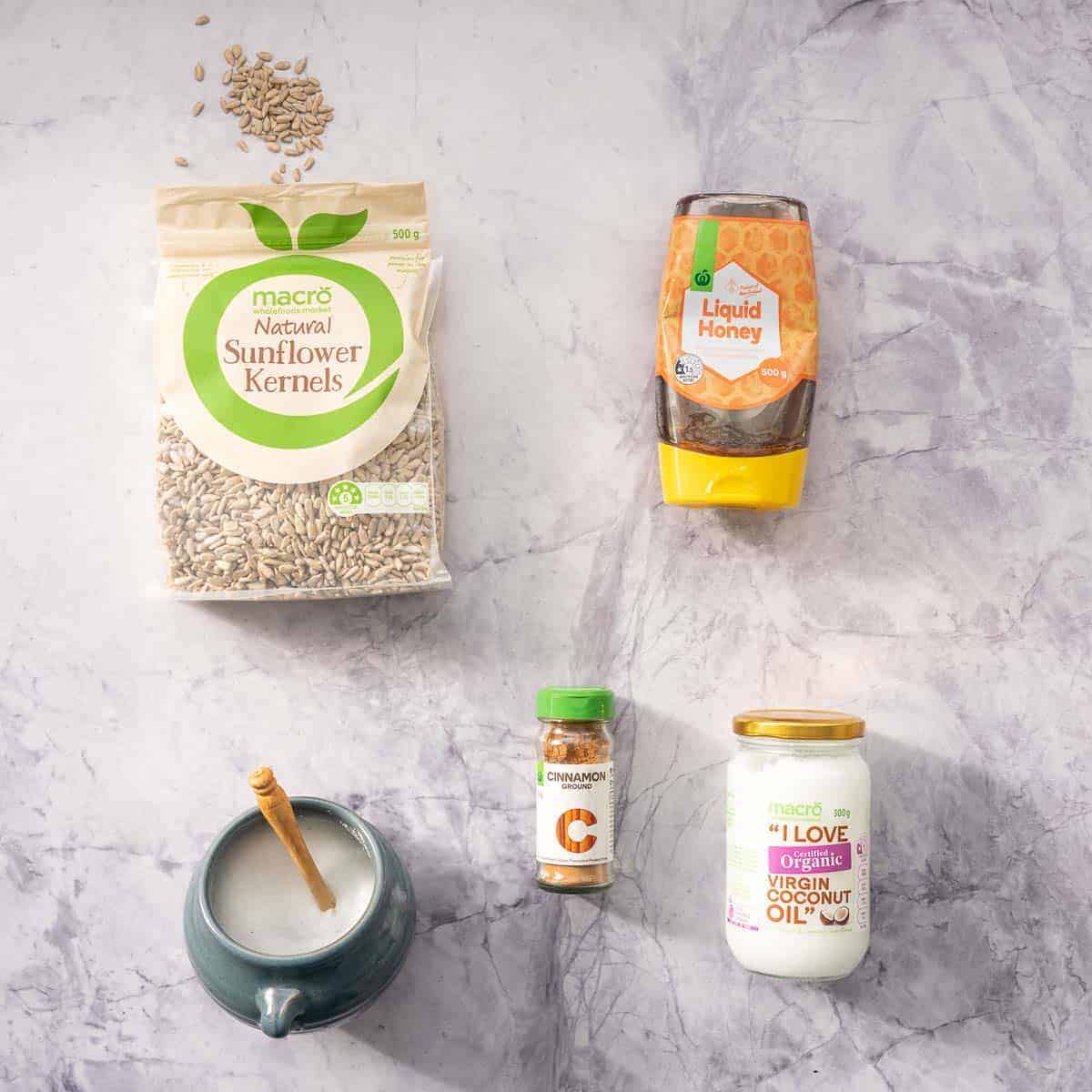 The ingredients to make honey roasted sunflower seeds laid out on a bench top