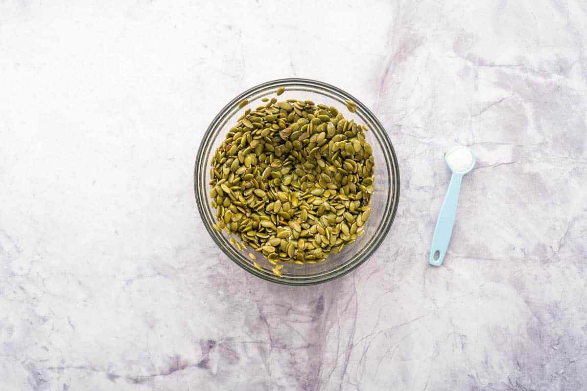 In a small glass mixing bowl fill with green seeds