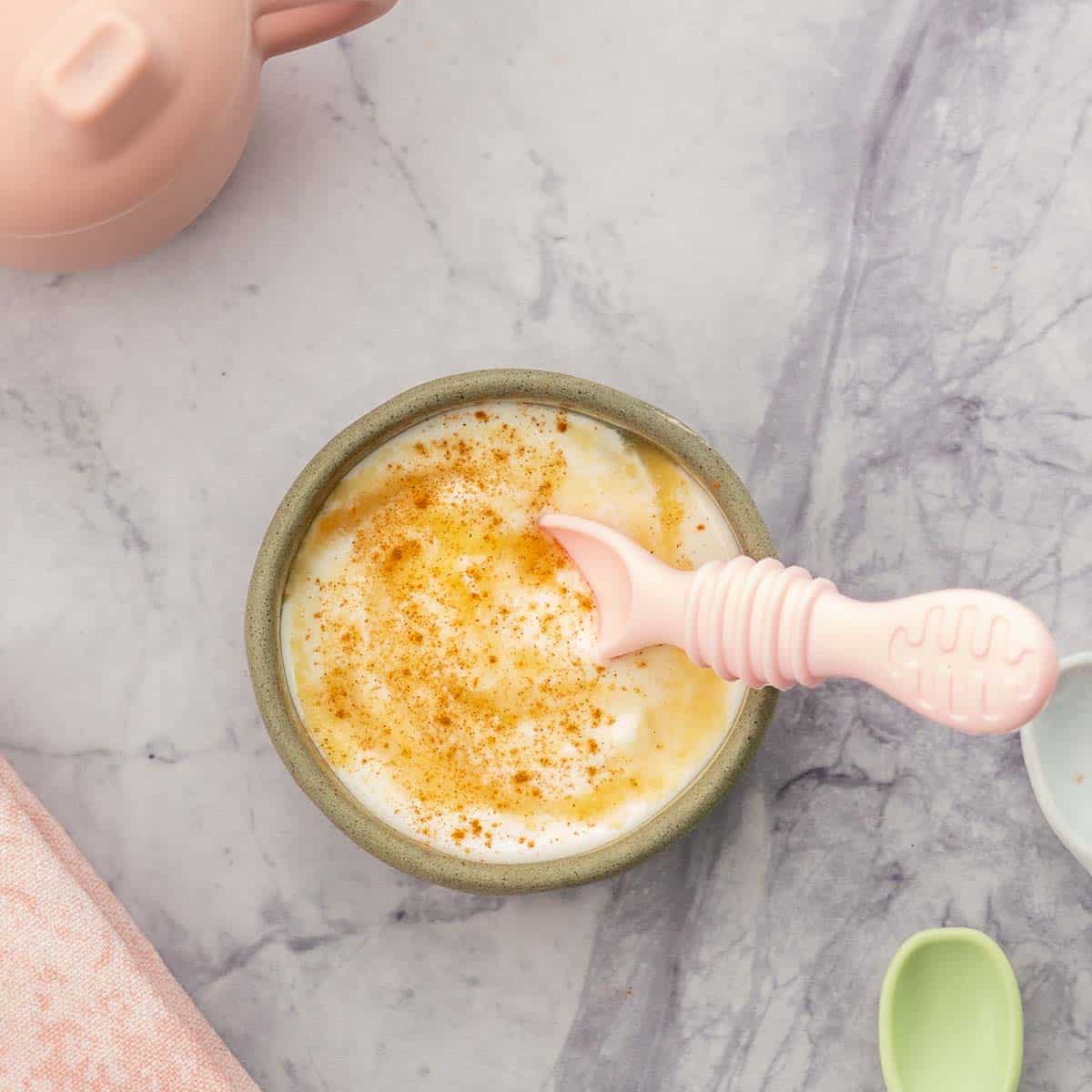 Yogurt swirled with apple puree and a dusting of cinnamon