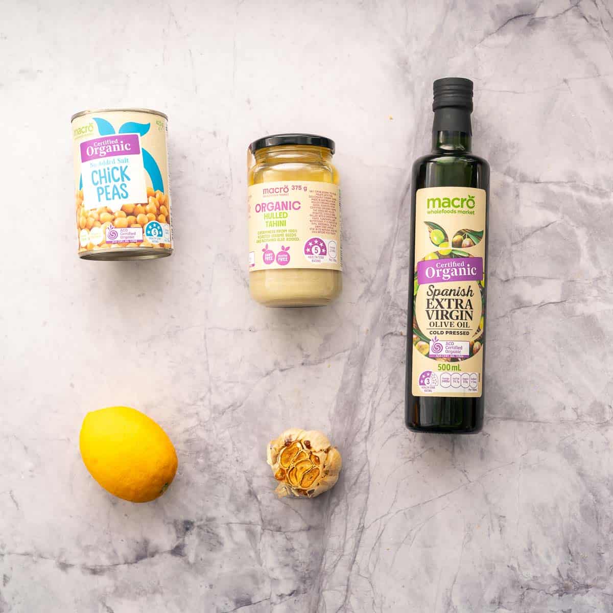 The ingredients used to make baby hummus laid out on a bench.