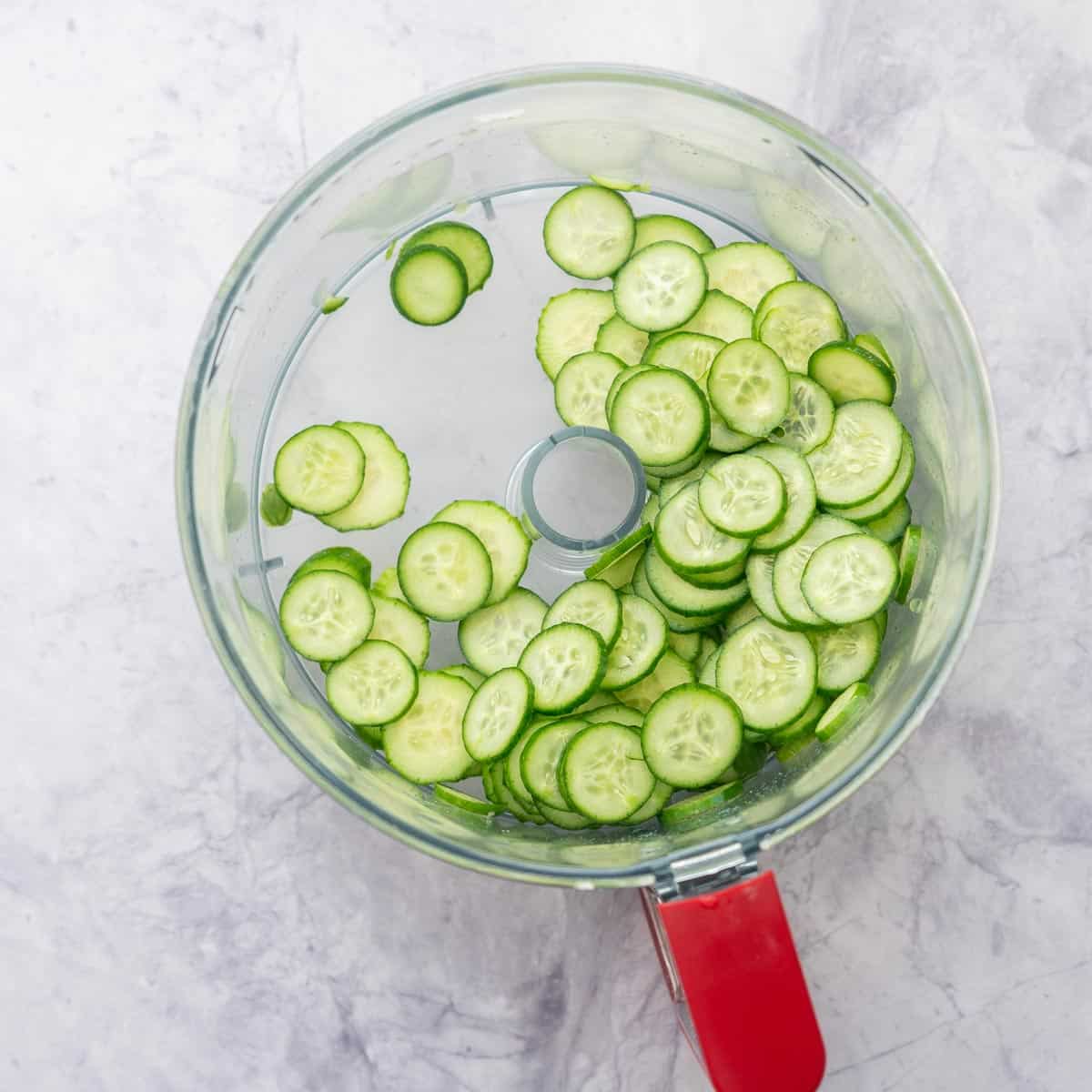 Cucumber slices in food processor.