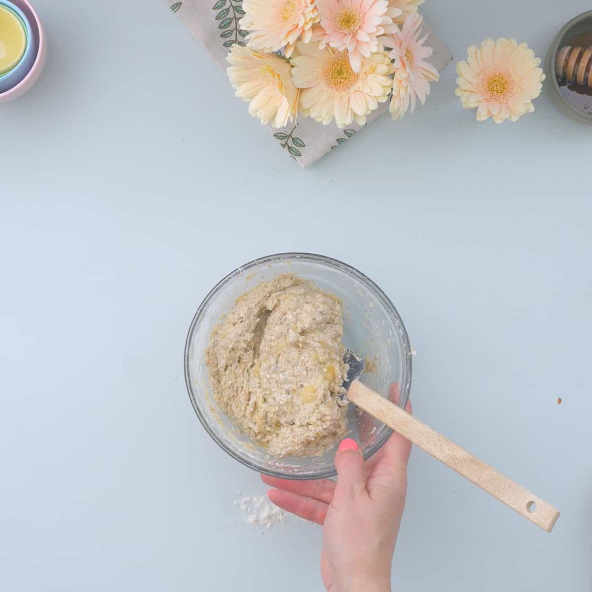 A bowl of sticky banana oatmeal cookie dough.