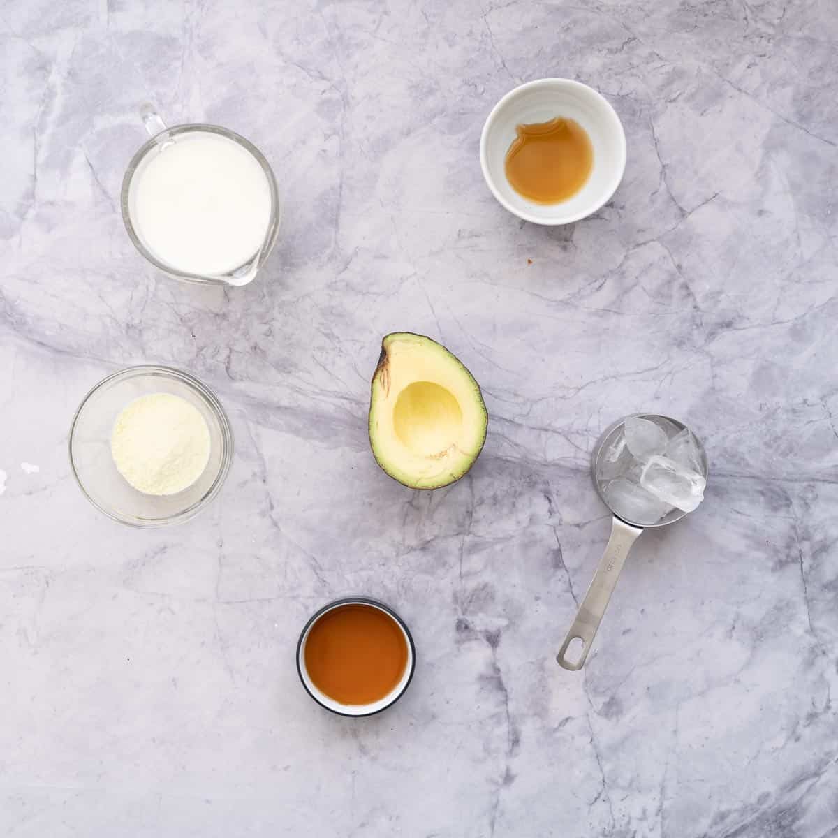 All the ingredients to make the Avocado Smoothie laid to on the bench in small ramekins.