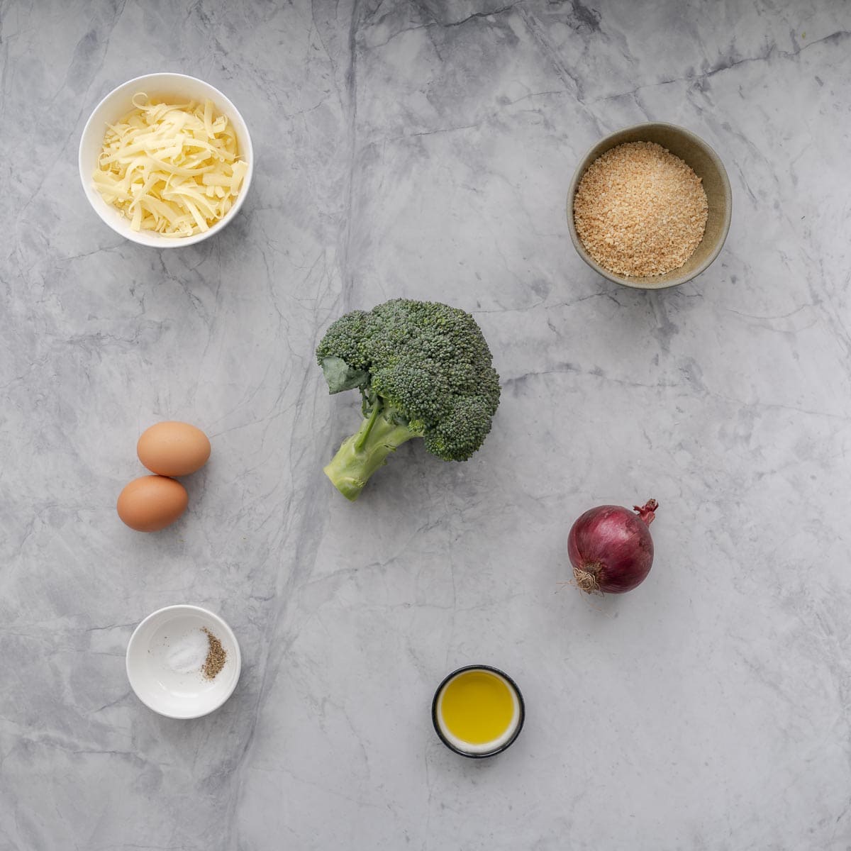 All the ingredients to make the broccoli bites laid out on the bench