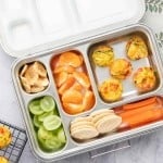 egg muffins, fruits and veggies packed in a lunch box.